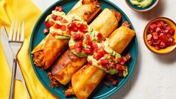 Fully Loaded Pork Taquitos with Pico de Gallo, Creamy Guacamole & Hot Sauce