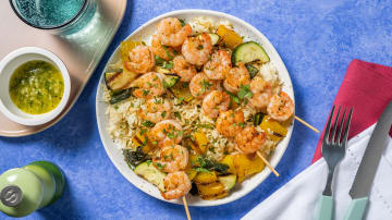 Cajun-Inspired Shrimp Skewers with Lemon-Garlic Butter and Jewelled Rice