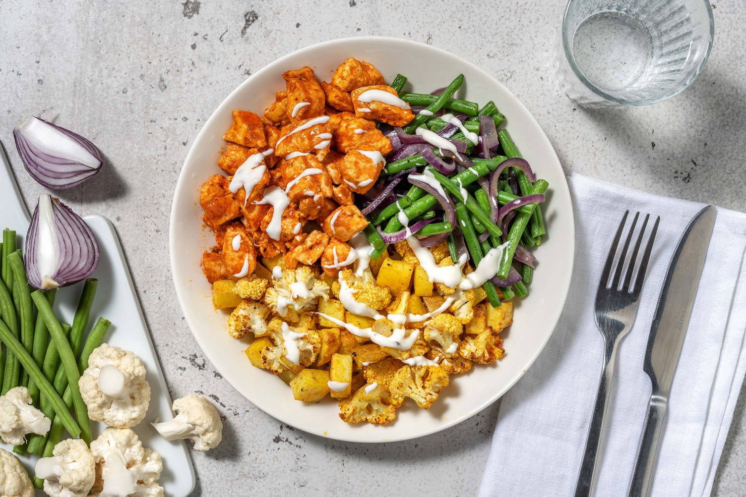 Varkensoester met harissa en geroosterde bloemkool