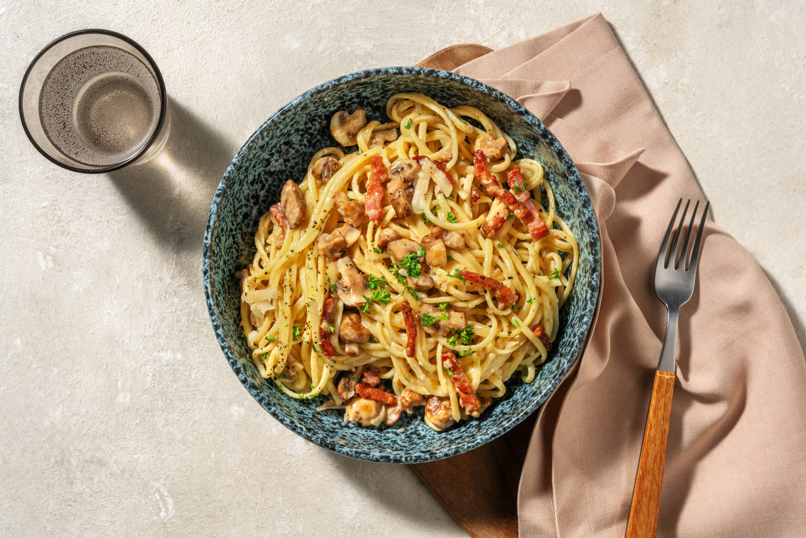 Linguine met champignonroomsaus en spekjes