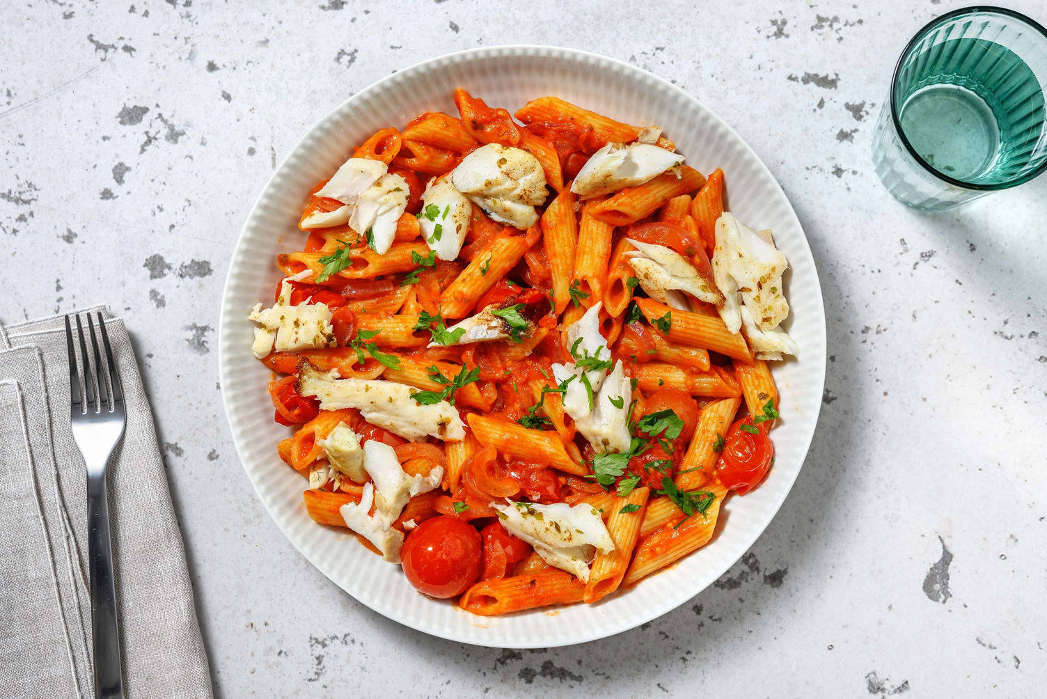 Penne met koolvis in mascarpone-kerstomatensaus