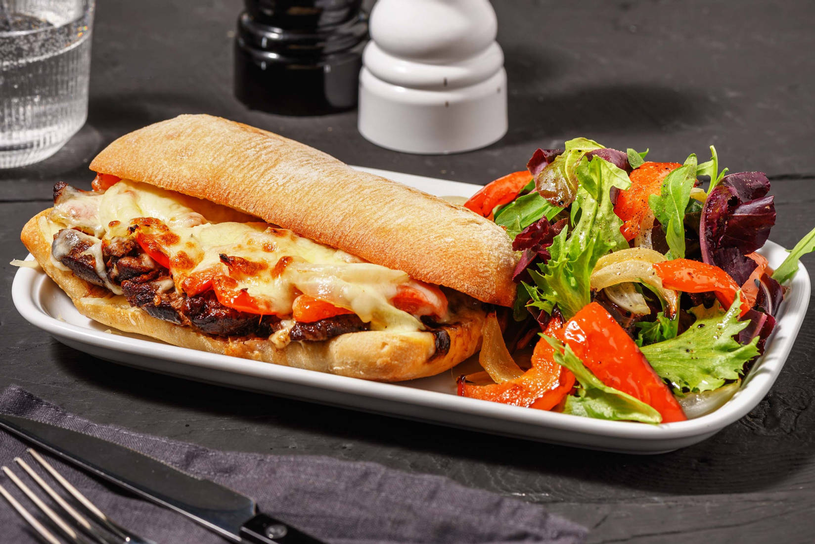 Italian-Style Ribeye Steak Sandwiches with Sautéed Peppers and Onions