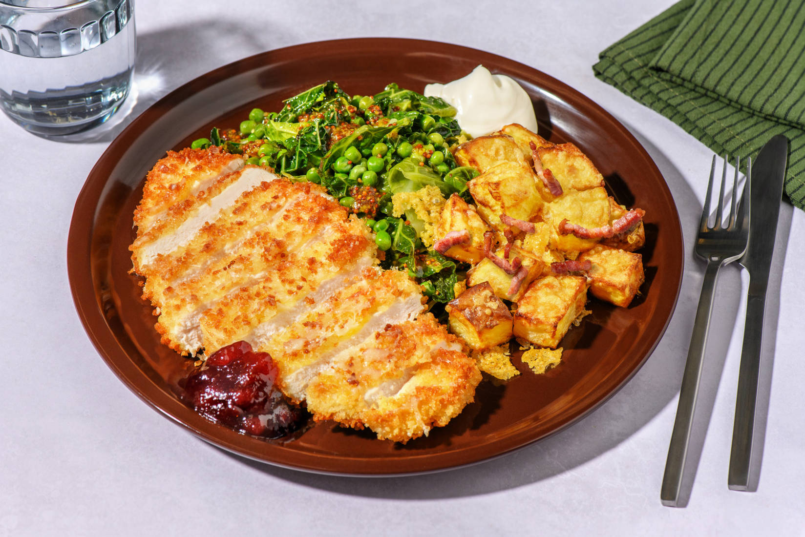 Alpine Inspired Chicken Schnitzel and Cheesy Bacon Roasties