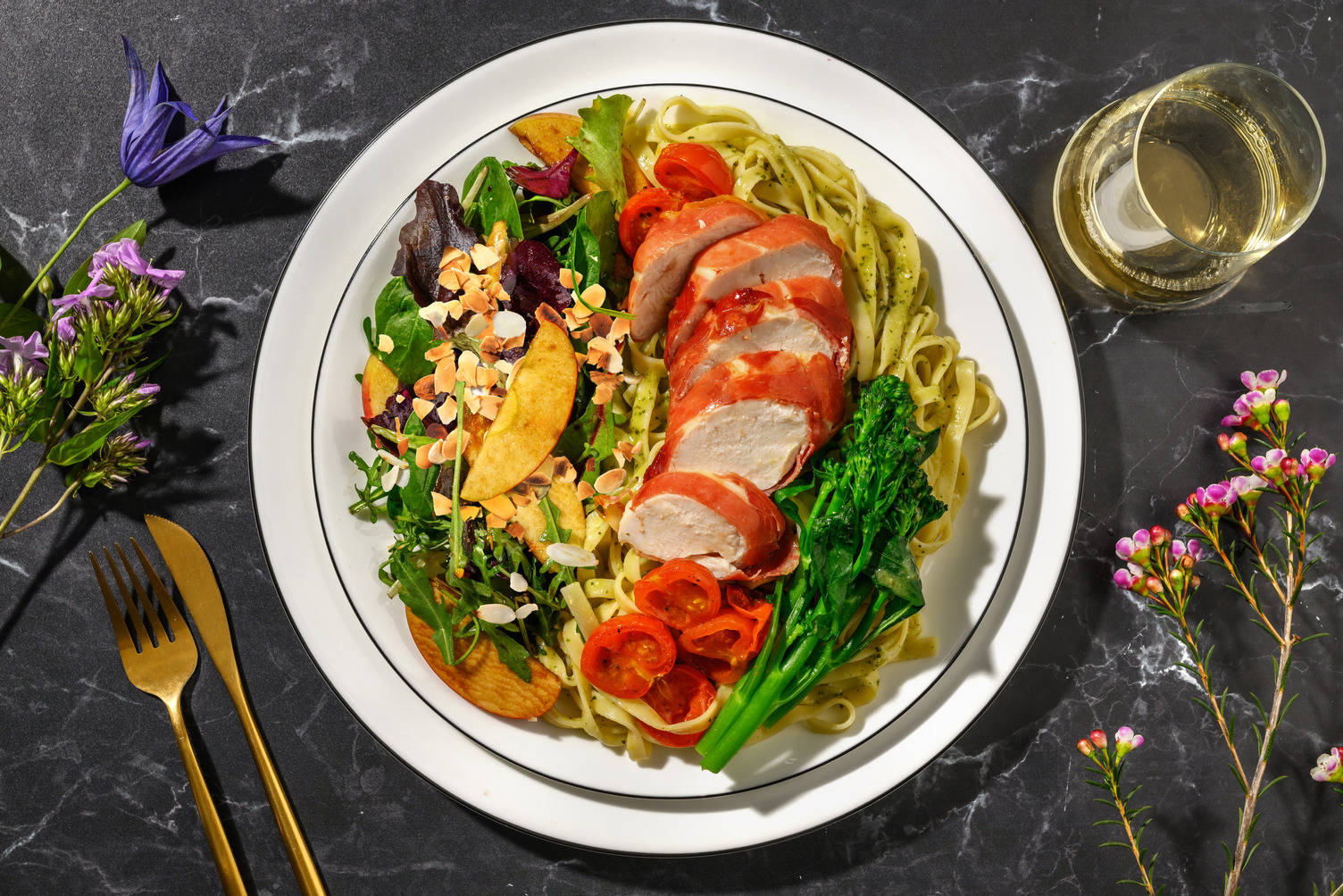 Serrano Ham Wrapped Chicken on Roasted Tomato Tagliatelle