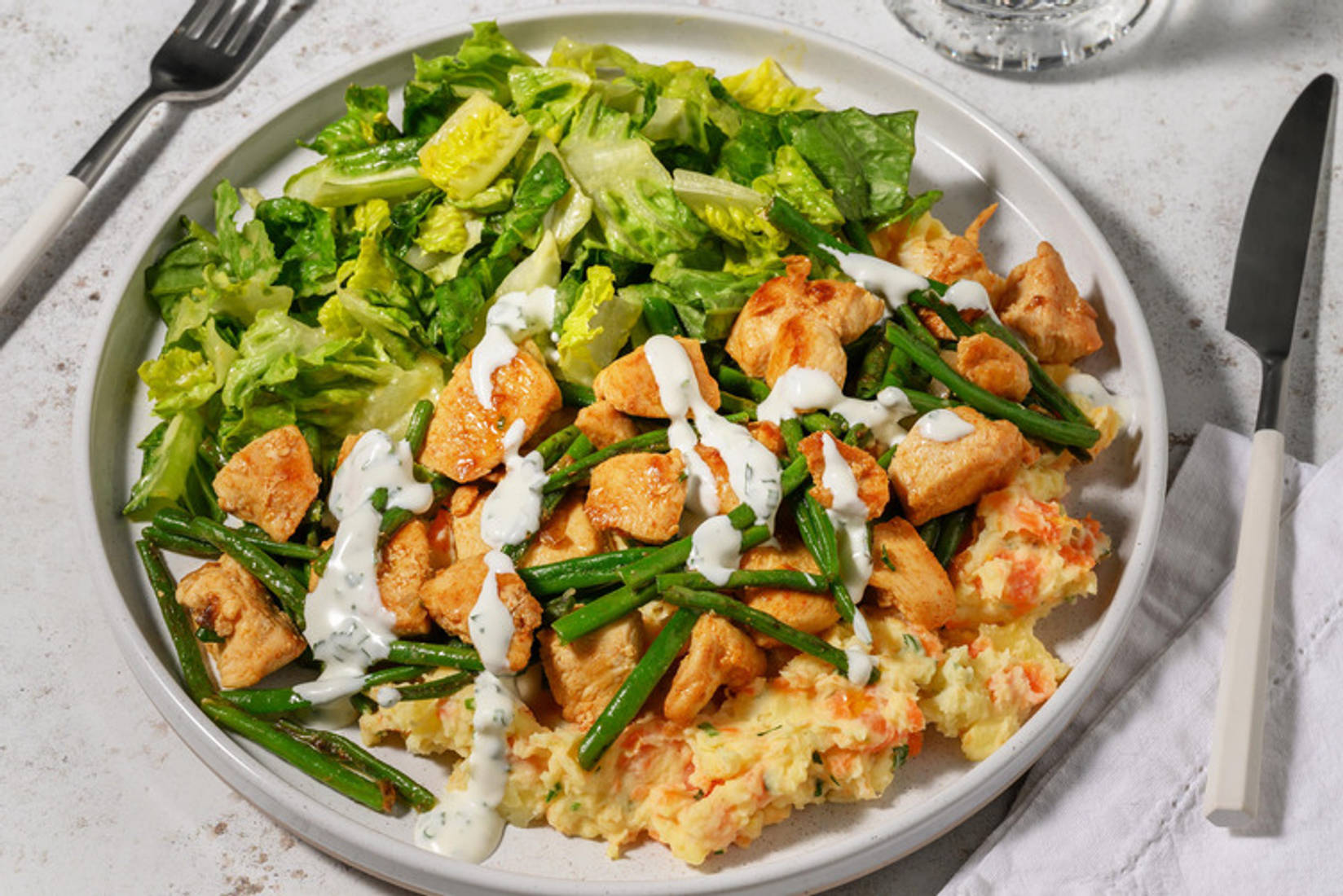 Hähnchengeschnetzeltes auf Karotten-Kartoffelstampf