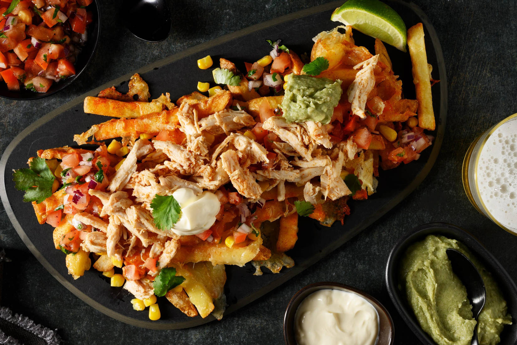 Cheesy loaded fries met pulled chicken