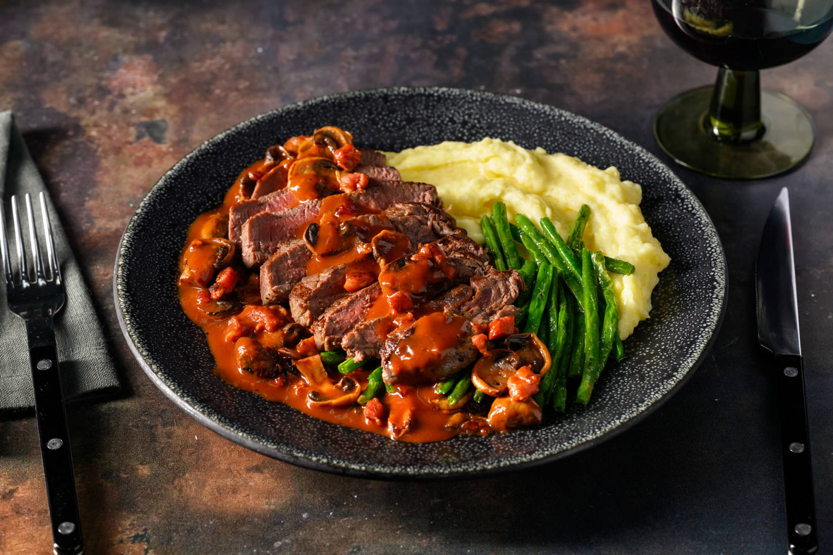 Venison Steak and Bacon Bourguignon Sauce