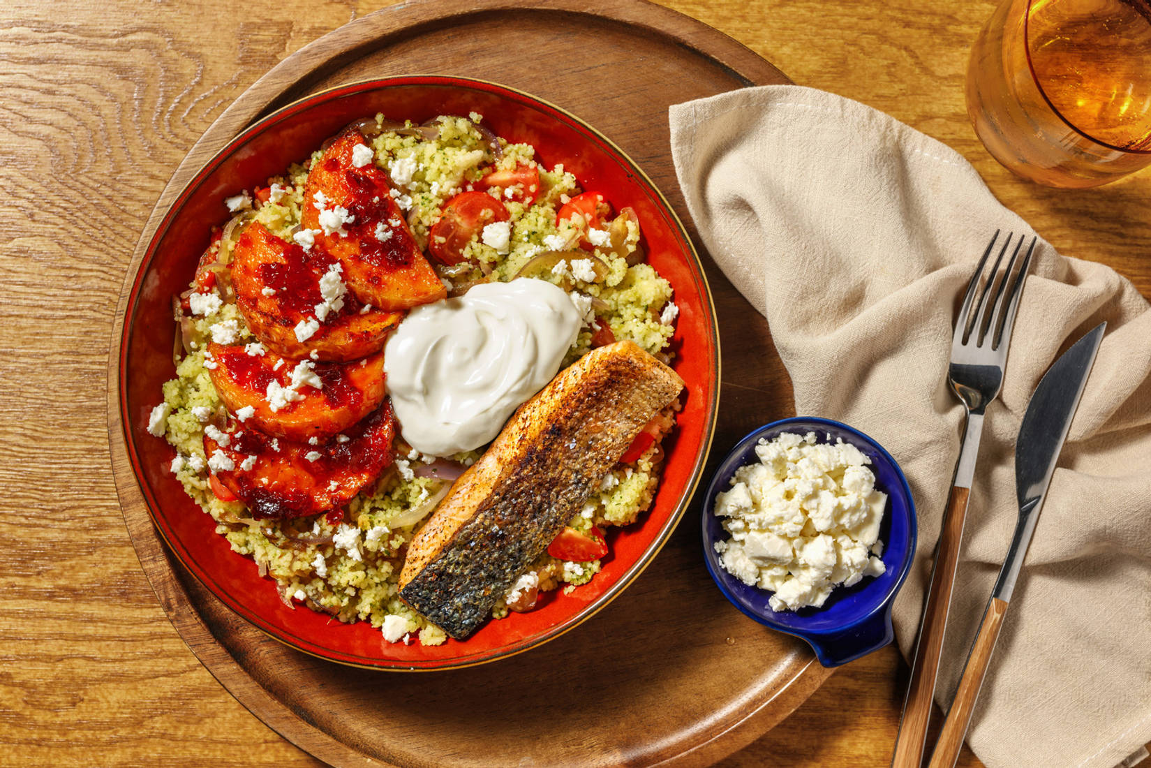 Salmon and Peri Peri Squash on Tomato Zhoug Couscous