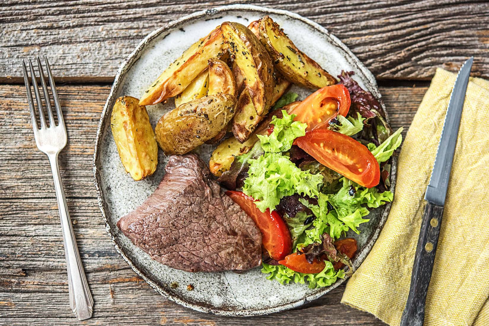 Rumpsteak mit gedünsteten Tomaten,