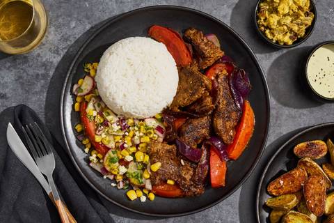 Lomo Saltado with Tomato Corn Salad