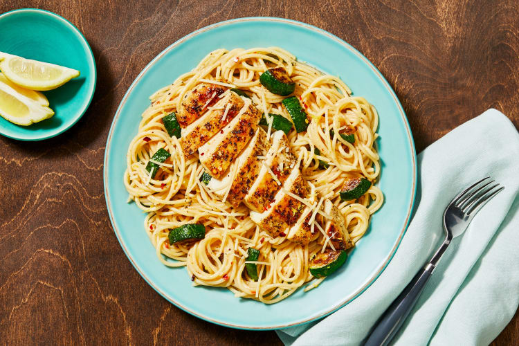 A plate of spaghetti with roasted chicken