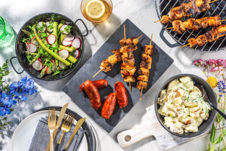 Chicken and Halloumi skewers Chorizo Sausages with Potato Salad and Fresh Seasonal Greens