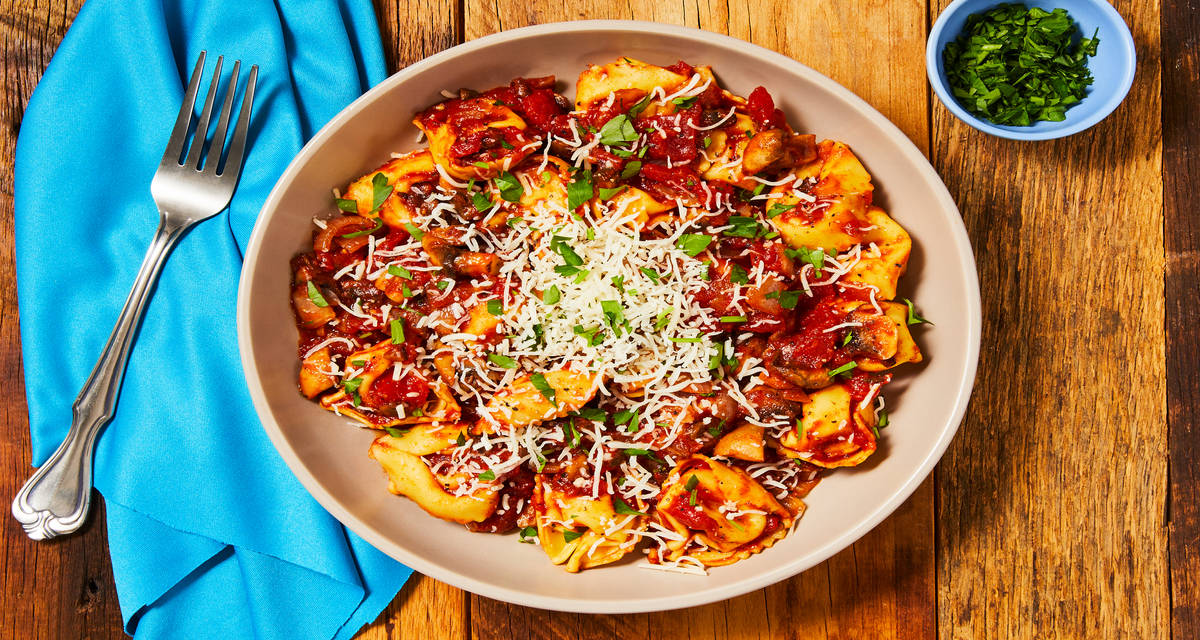 Mushroom & Tomato Tortelloni Topped with Italian Cheese Blend & Fresh Parsley