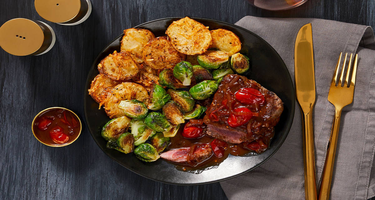 Beef Tenderloin and Burst Balsamic Tomatoes with Cheesy Potato Rounds and Roasted Brussels Sprouts