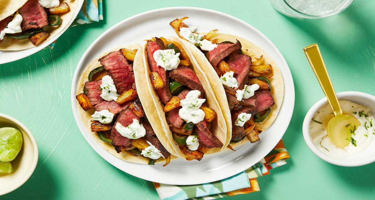 Marinated Steak Tacos with Charred Pineapple and Lime Crema