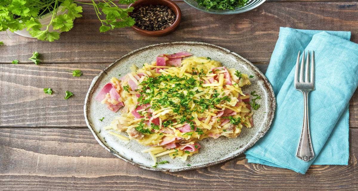 Stoemp jambon-fromage au chou blanc Avec des champignons à la moutarde