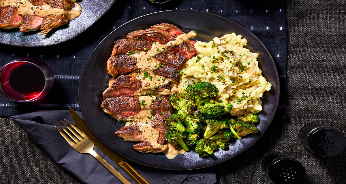 10-oz Ribeye and Mustard Peppercorn Sauce with Chive Mashed Potatoes and Roasted Broccoli