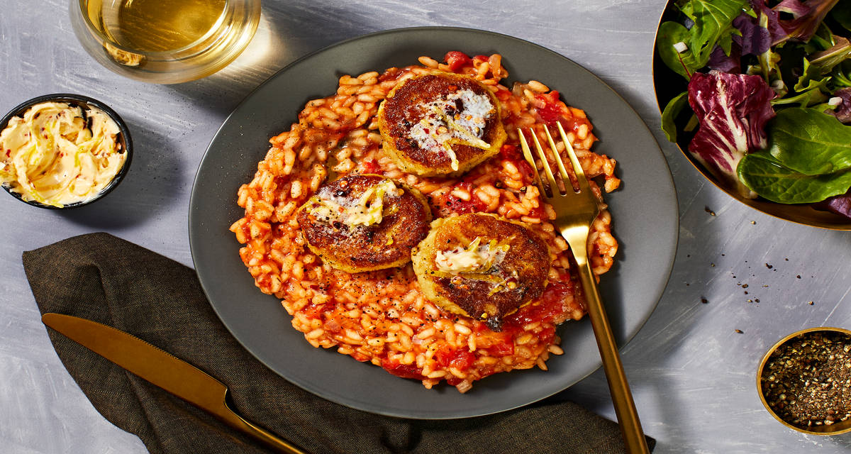 Crab Cakes over Risotto Fra Diavolo with Lemon Chili Butter and Spring Mix Salad