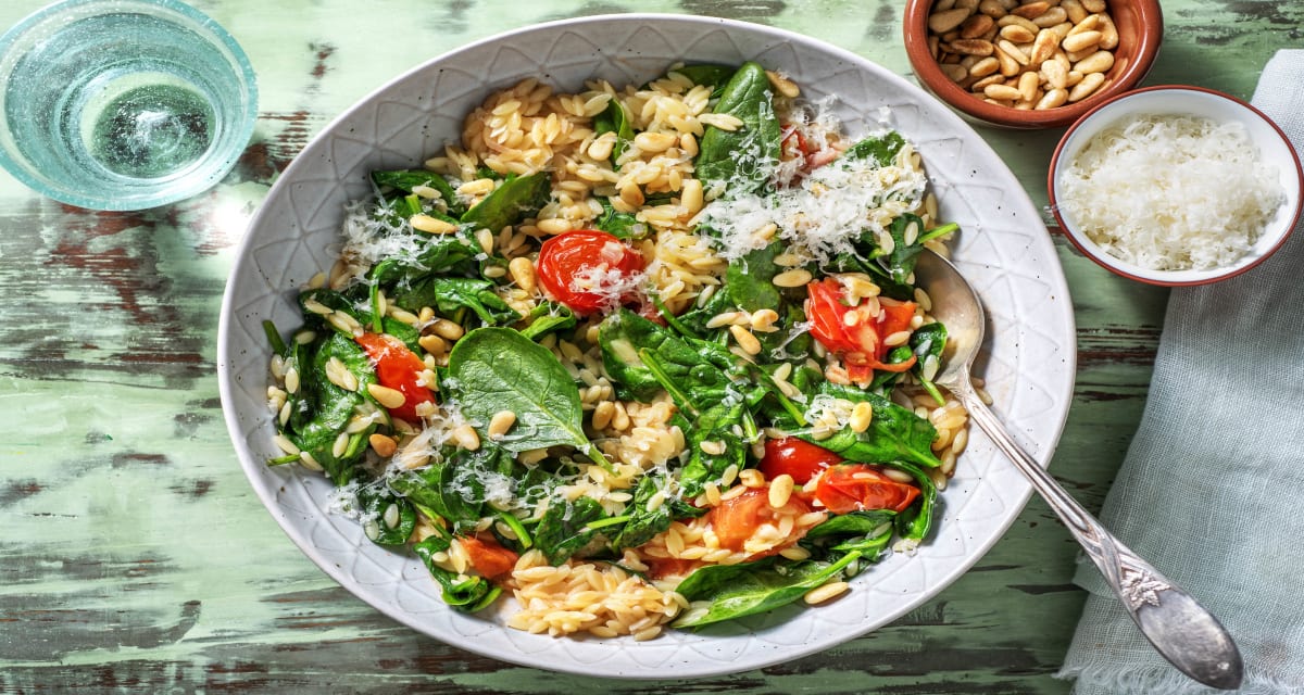 Orzo met spinazie en cherrytomaten met grana padano en pijnboompitten-image
