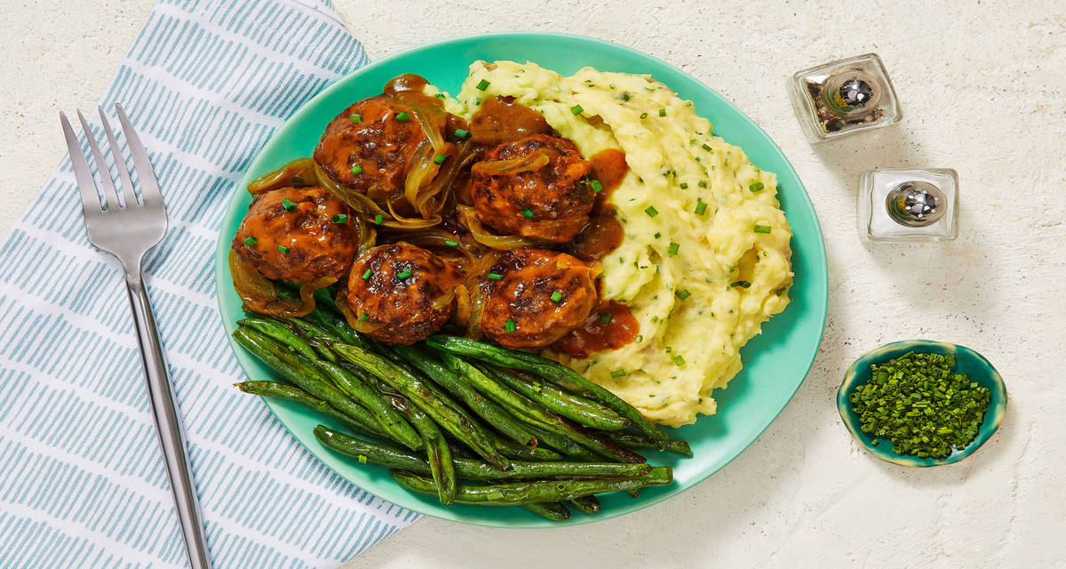 Gravy-Smothered Meatballs over Chive Mashed Potatoes with Roasted Green Beans