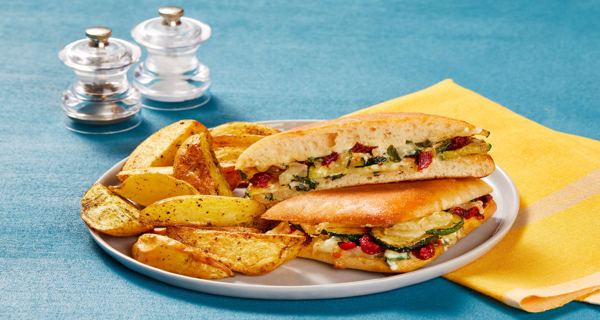 Zucchini & Sun-Dried Tomato Panini with Melty Mozz, Basil Sauce & Italian-Seasoned Potato Wedges