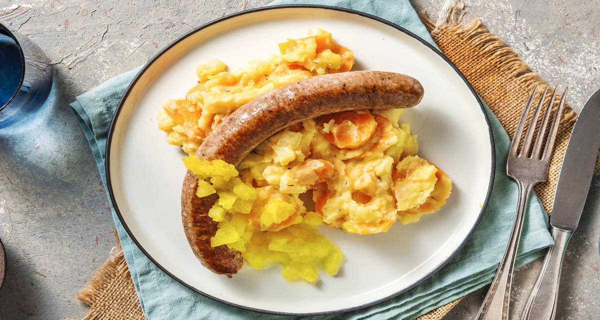 Saucisse de porc et stoemp de carottes accompagnés d'une compote maison