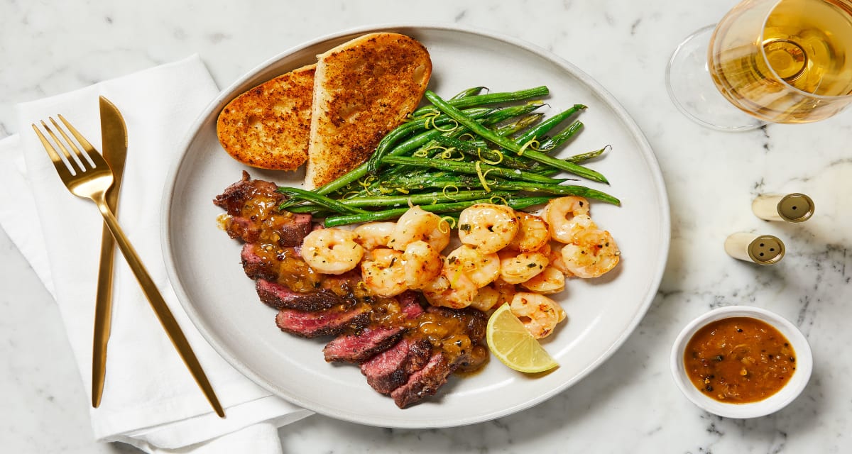 Steak au Poivre & Garlic Herb Shrimp with Garlic Bread & Lemony Green Beans-image