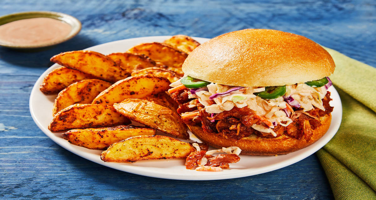 Kickin’ BBQ Pulled Chicken Sandwiches with Pickled Jalapeño, Smoky Slaw & Potato Wedges