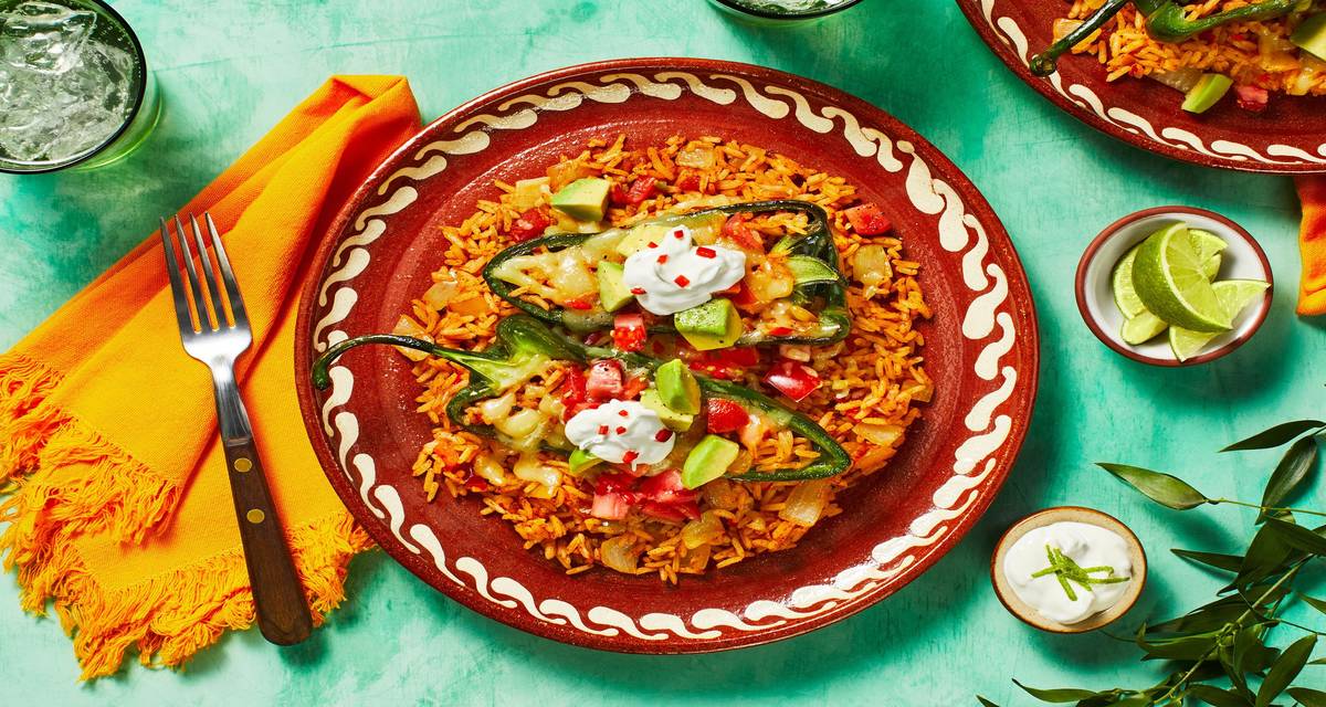 Mexican Cheesy Rice-Stuffed Poblanos with Avocado Salsa & Zesty Crema