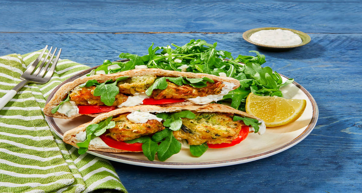 Zucchini & Feta Fritter Pita Pockets with Feta, Creamy Dill Sauce & Arugula Salad