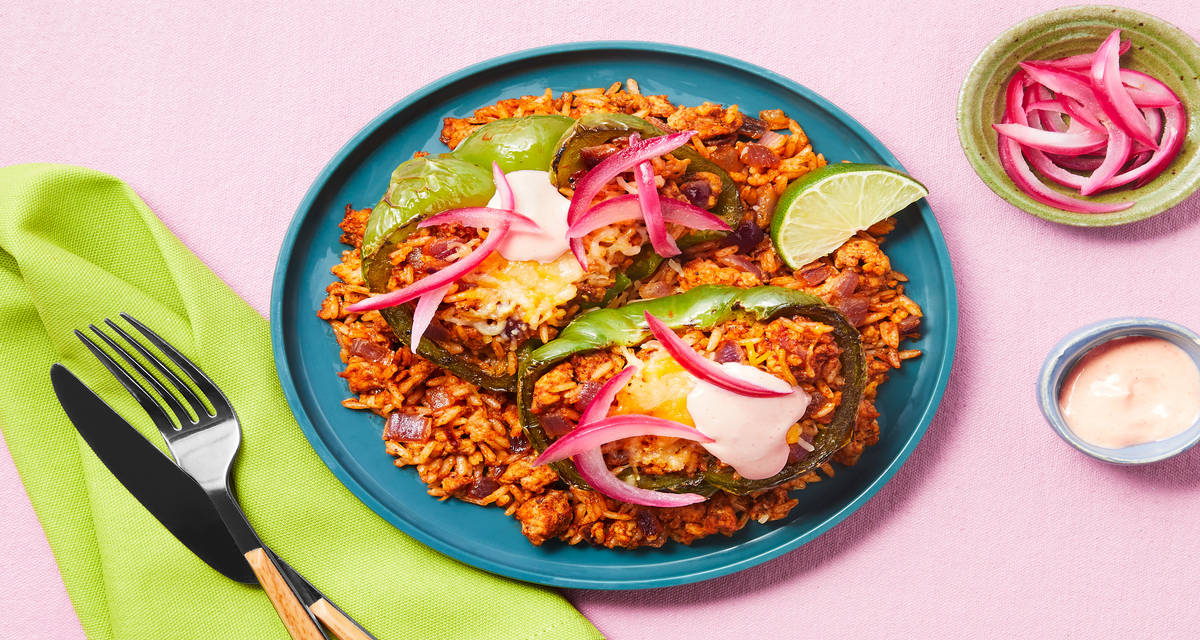 Tex-Mex Turkey Stuffed Peppers with Smoky Red Pepper Crema & Pickled Red Onion