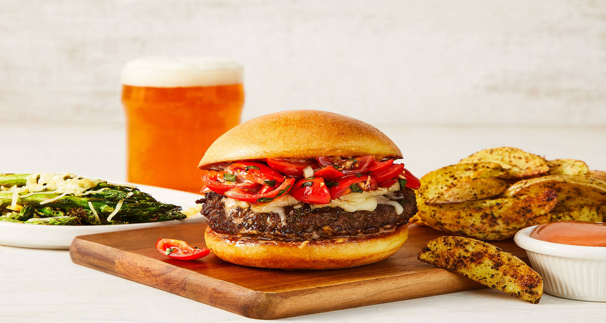 Bellissimo Bruschetta Burgers with Herby Potato Wedges & Parmesan-Roasted Asparagus