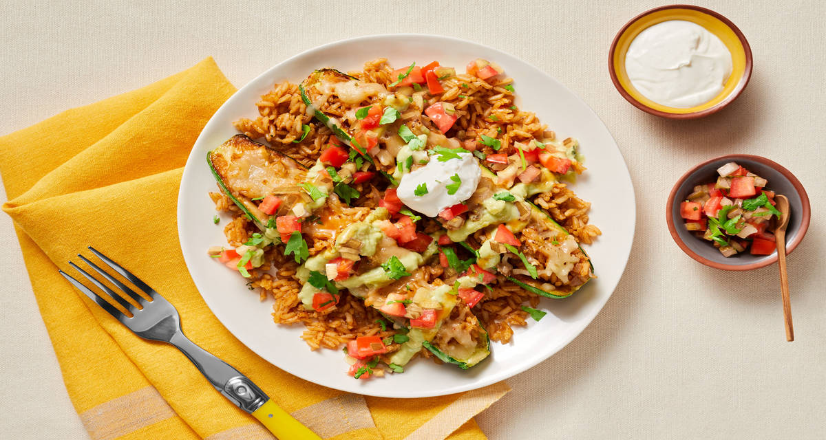 Southwest Stuffed Zucchini Boats with Plant-based Protein, Pico de Gallo & Avocado Crema