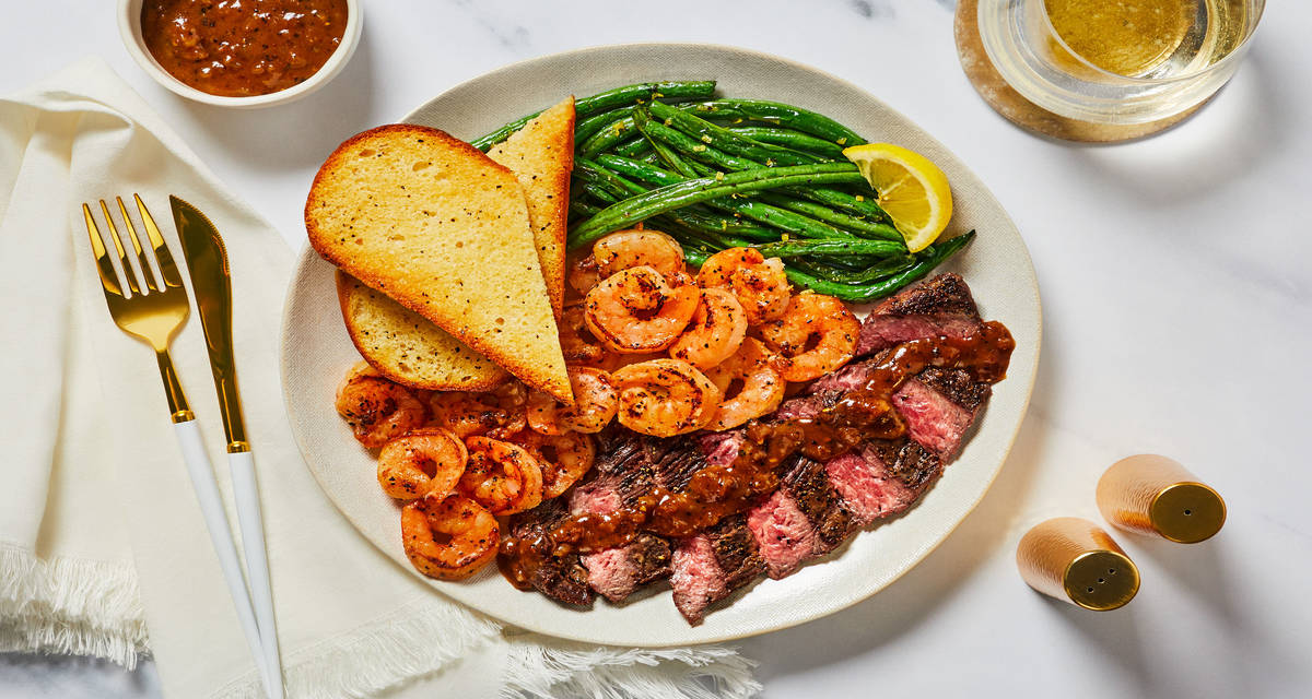 Steak au Poivre & Garlic Herb Shrimp with Garlic Bread & Lemony Green Beans
