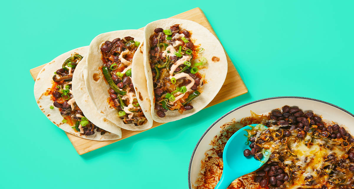 Cheesy Bean & Plant-Based Protein Tacos with Poblano & Smoky Red Pepper Crema