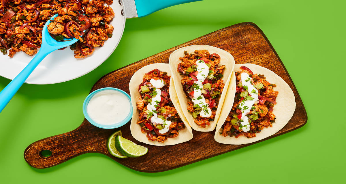 One-Pan Pork & Green Pepper Tacos with Kiwi Salsa & Lime Crema