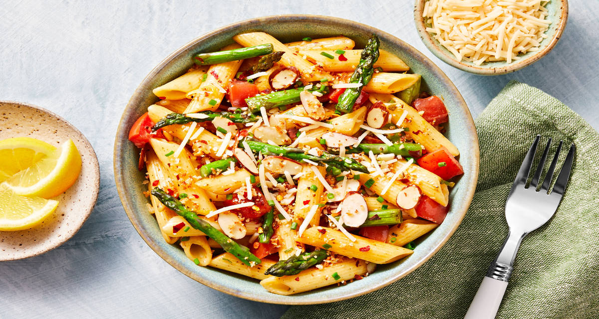 Salmon Penne Rustica with a Kick tossed with Asparagus & topped with Crispy Panko