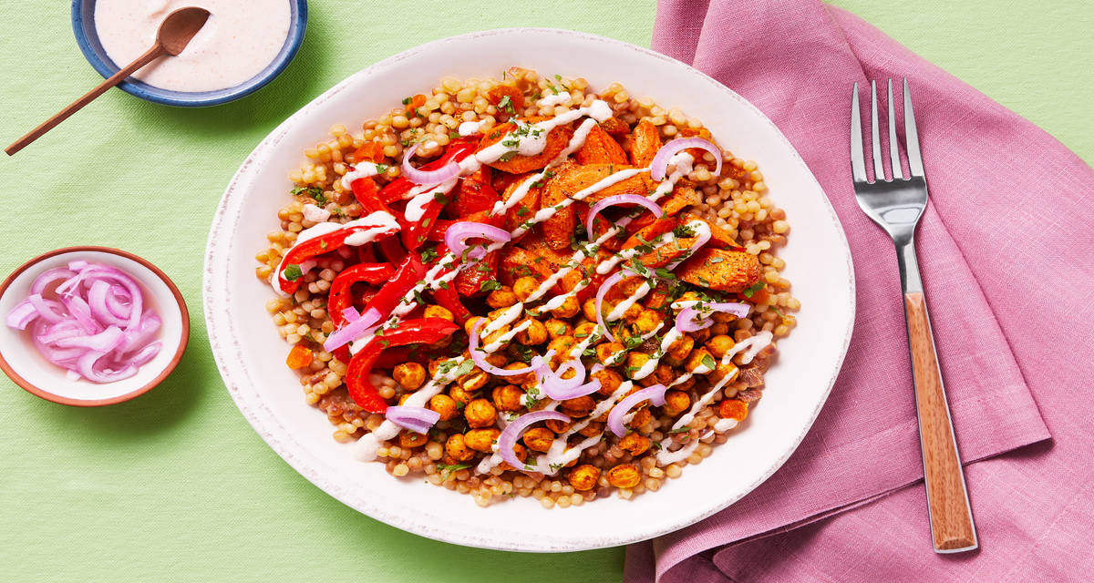 Shawarma-Spiced Chickpea Couscous Bowls with Roasted Veggies, Pickled Onion & Harissa Yogurt Sauce