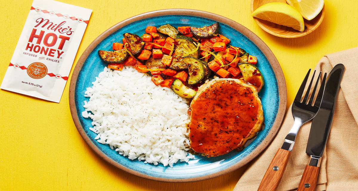 Mike’s Hot Honey® Peach Pork Chops with Rice & Lemony Roasted Veggies