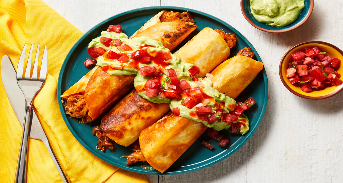 Fully Loaded Beef Taquitos with Pico de Gallo, Creamy Guacamole & Hot Sauce