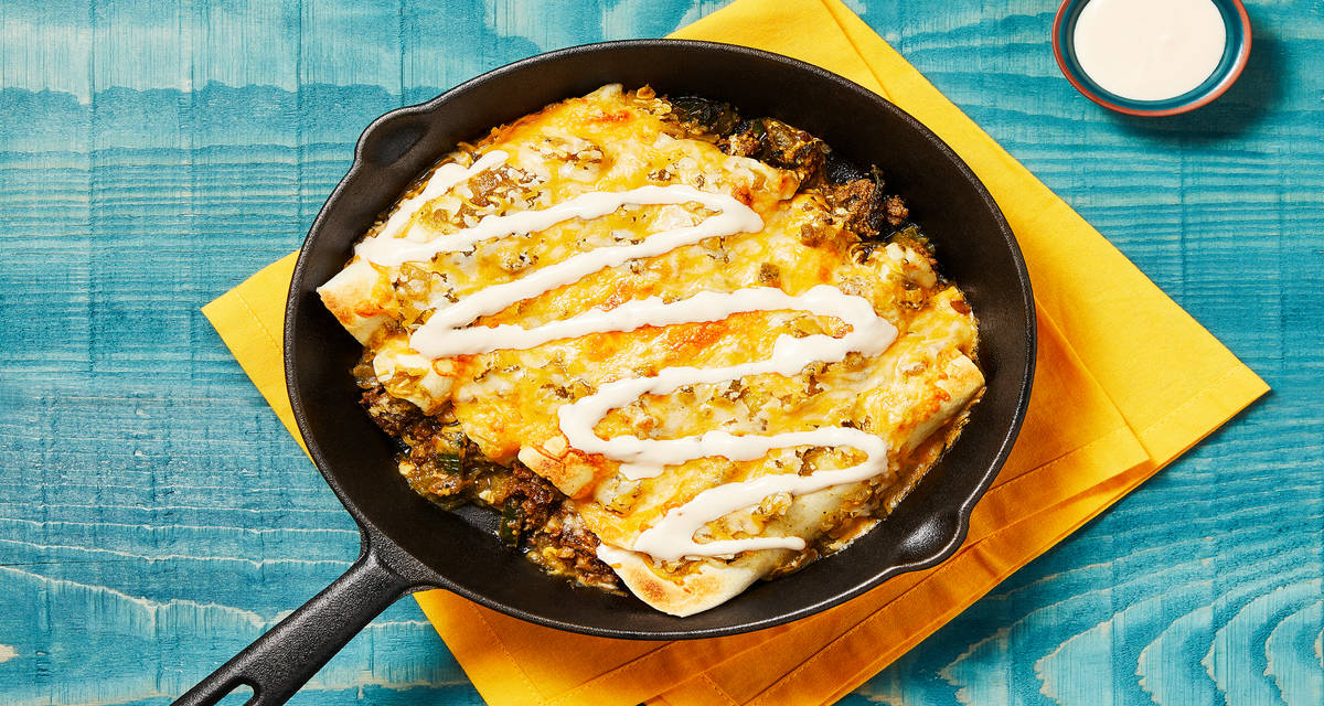 One-Pan Beef Enchiladas Verdes with Mexican Cheese Blend & Hot Sauce Crema
