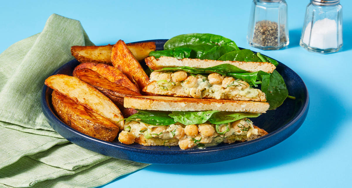 Creamy Pesto Chickpea Salad Sandwiches with Lemony Spinach & Potato Wedges