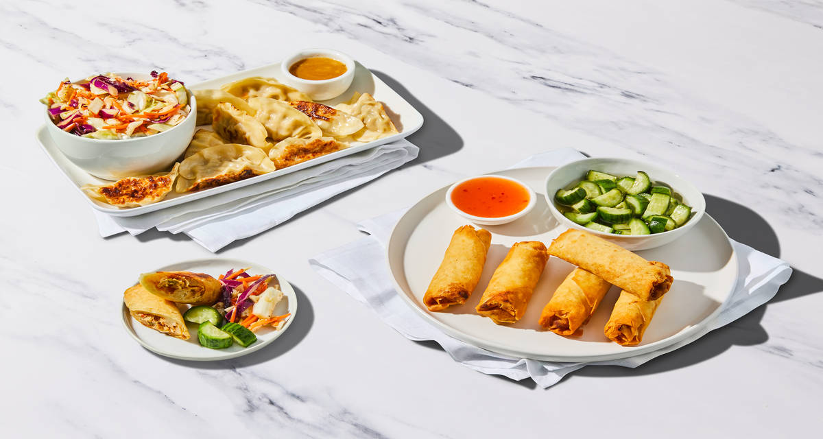 Chicken Dumplings & Veggie Spring Rolls Board with Pickled Cucumber & Sesame Slaw | 4 Servings