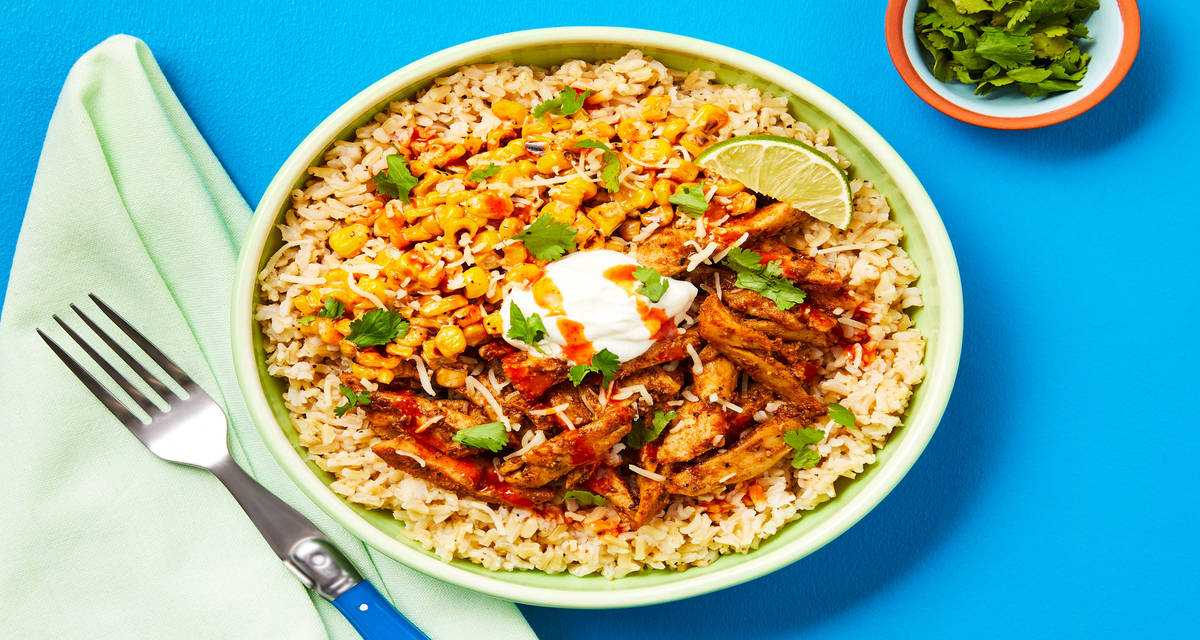 Taqueria Chicken Bowls with Brown Rice, Corn Esquites, Sour Cream, Hot Sauce & Cilantro