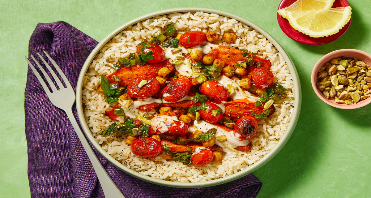 Spice Market Chicken Rice Bowls with Blistered Tomatoes, Schug Sauce, Lemon Aioli & Pistachios