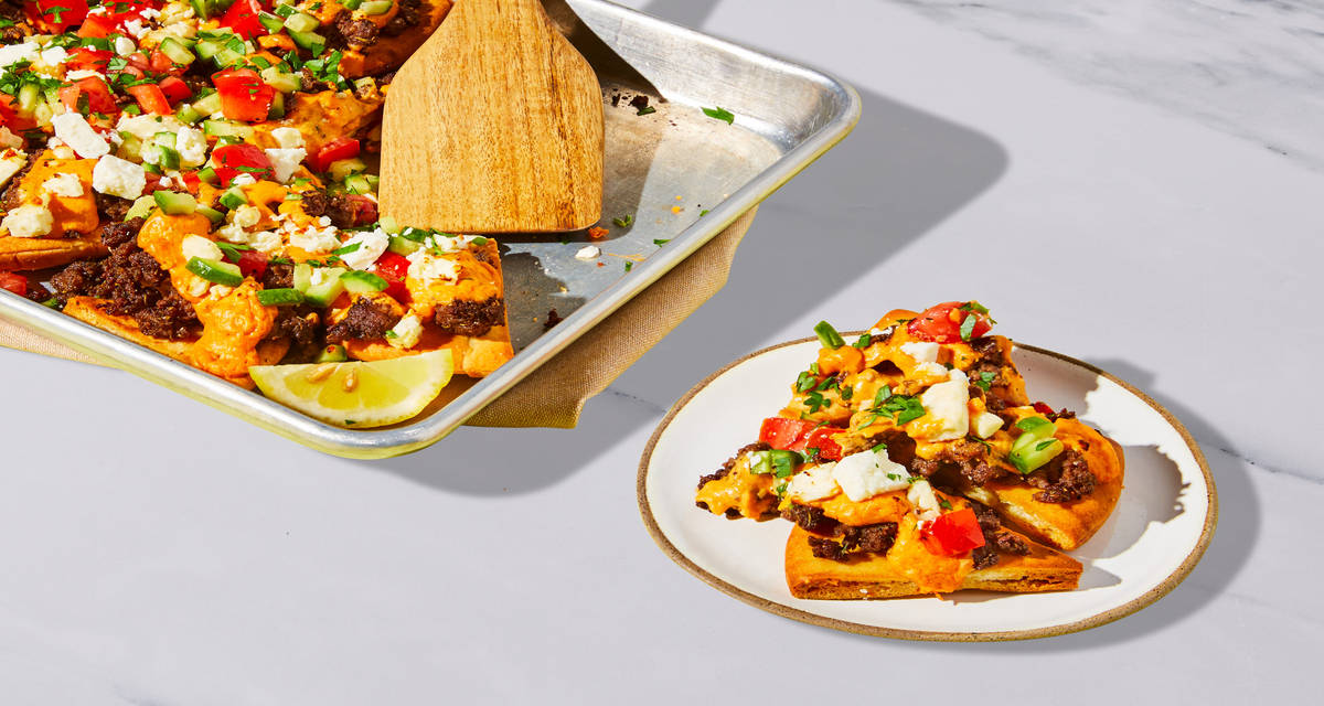 Mediterranean Loaded Beef Pita “Nachos” with Creamy Hummus Sauce, Cucumber Tomato Salad & Feta | 4 servings