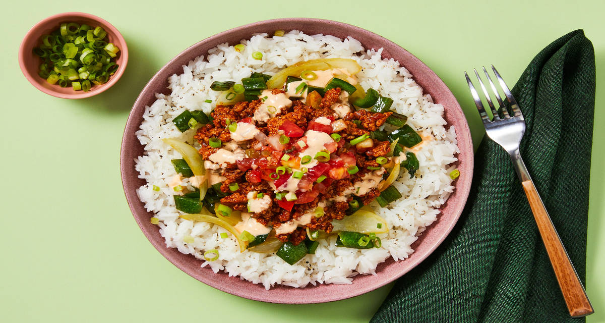 Saucy Chicken Burrito Bowls with Charred Green Pepper, Pico de Gallo & Smoky Crema