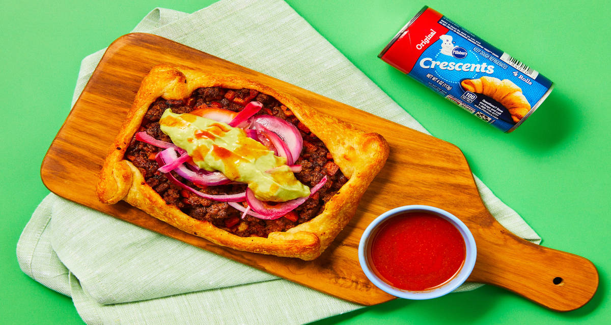 Tex-Mex Beef “Taco” Pies with Pillsbury™️ Original Crescent Rolls, Pickled Onion & Creamy Guacamole