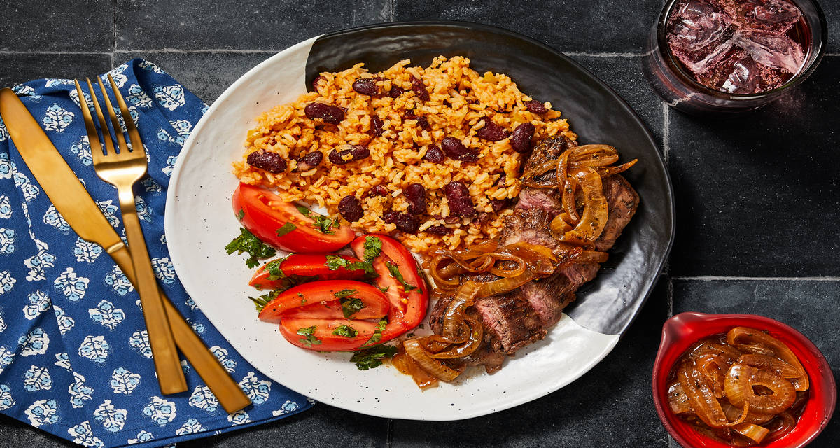 Dominican-Style Bistec Encebollado Steak with Rice & Beans plus a Tomato Salad