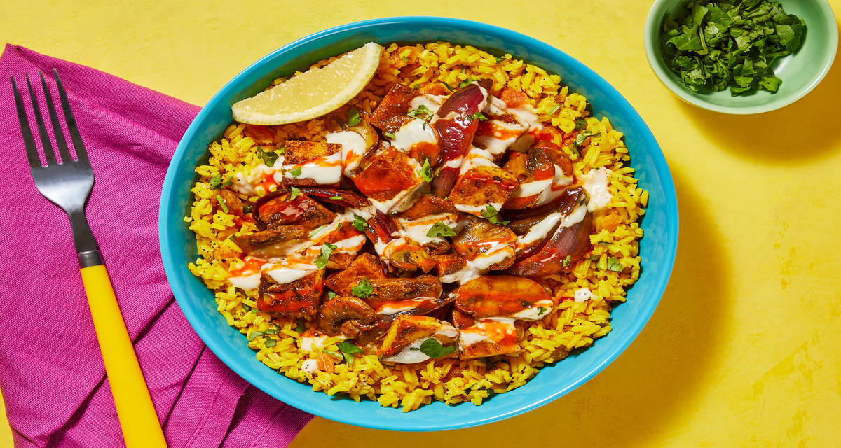 Shawarma-Spiced Tofu & Mushroom Bowls with Apricot Turmeric Rice, White Sauce & Hot Sauce